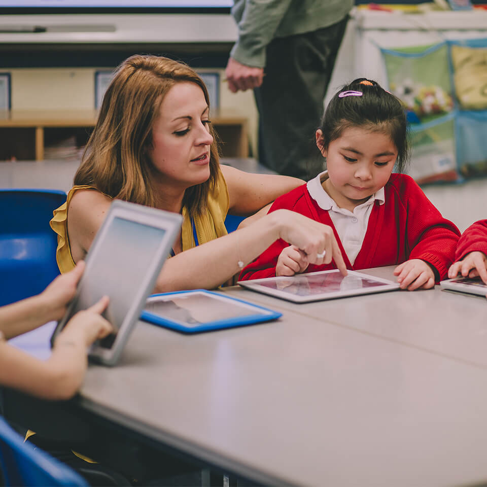 Teacher guiding student through Mathletics
