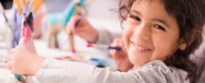 girl painting a craft project