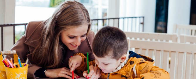 mother drawing with her young son
