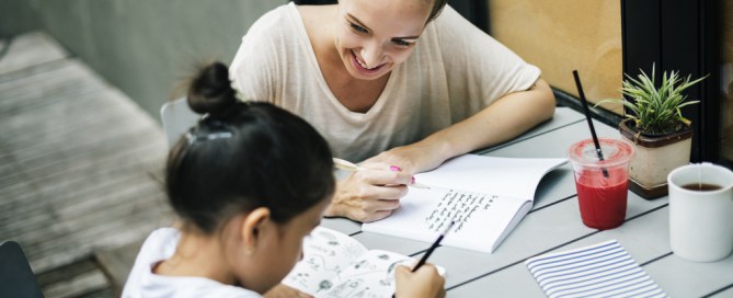 mother helping daughter do her homework