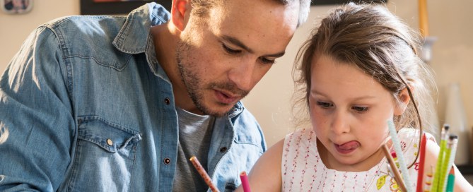 father helps daughter with her homework