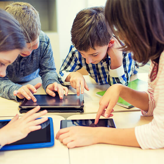 Testimonial pic 3 Excited students using Mathletics on tablets